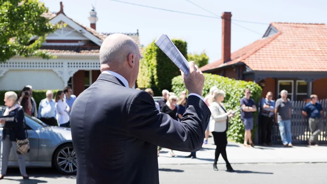 Auctioneer calling bids outside a Melbourne home