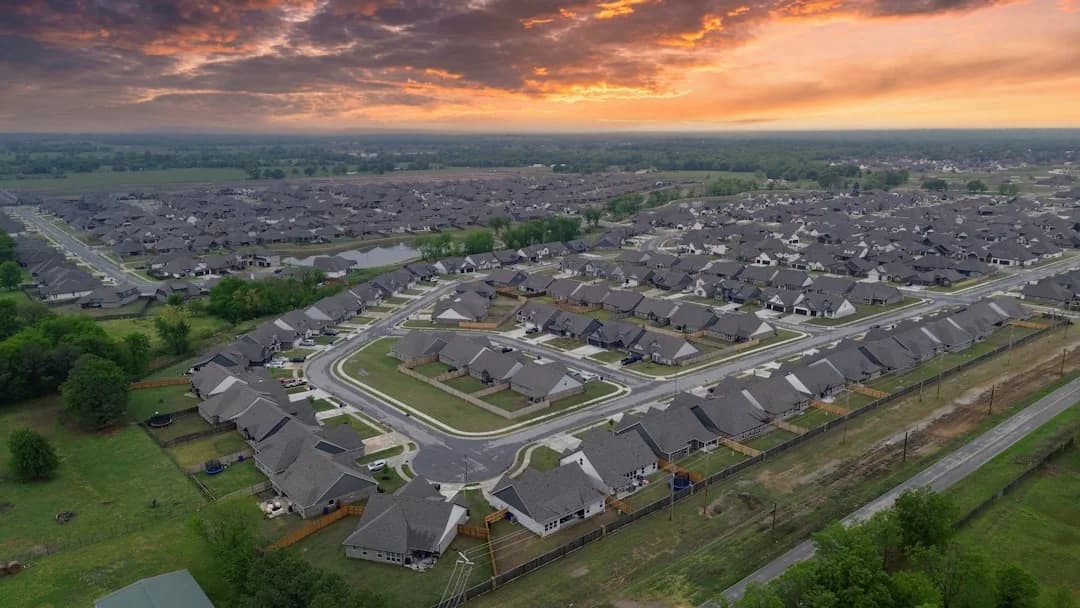 Aerial view of a suburban housing estate at sunset