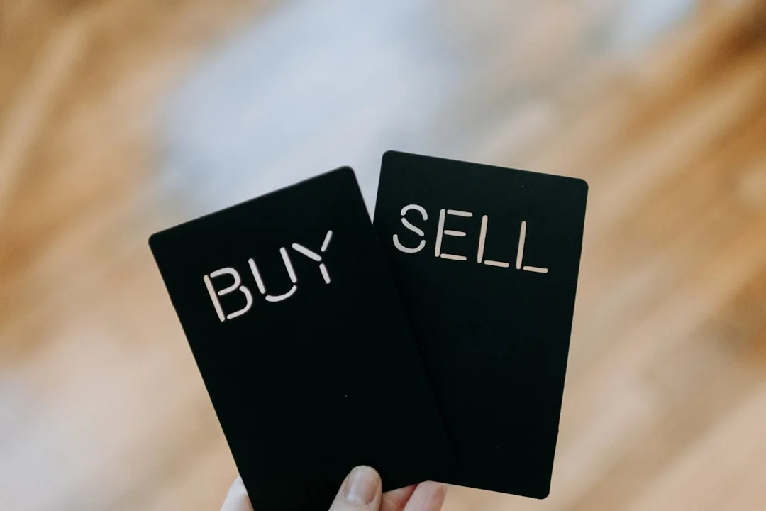 Buy and sell cards held side by side
