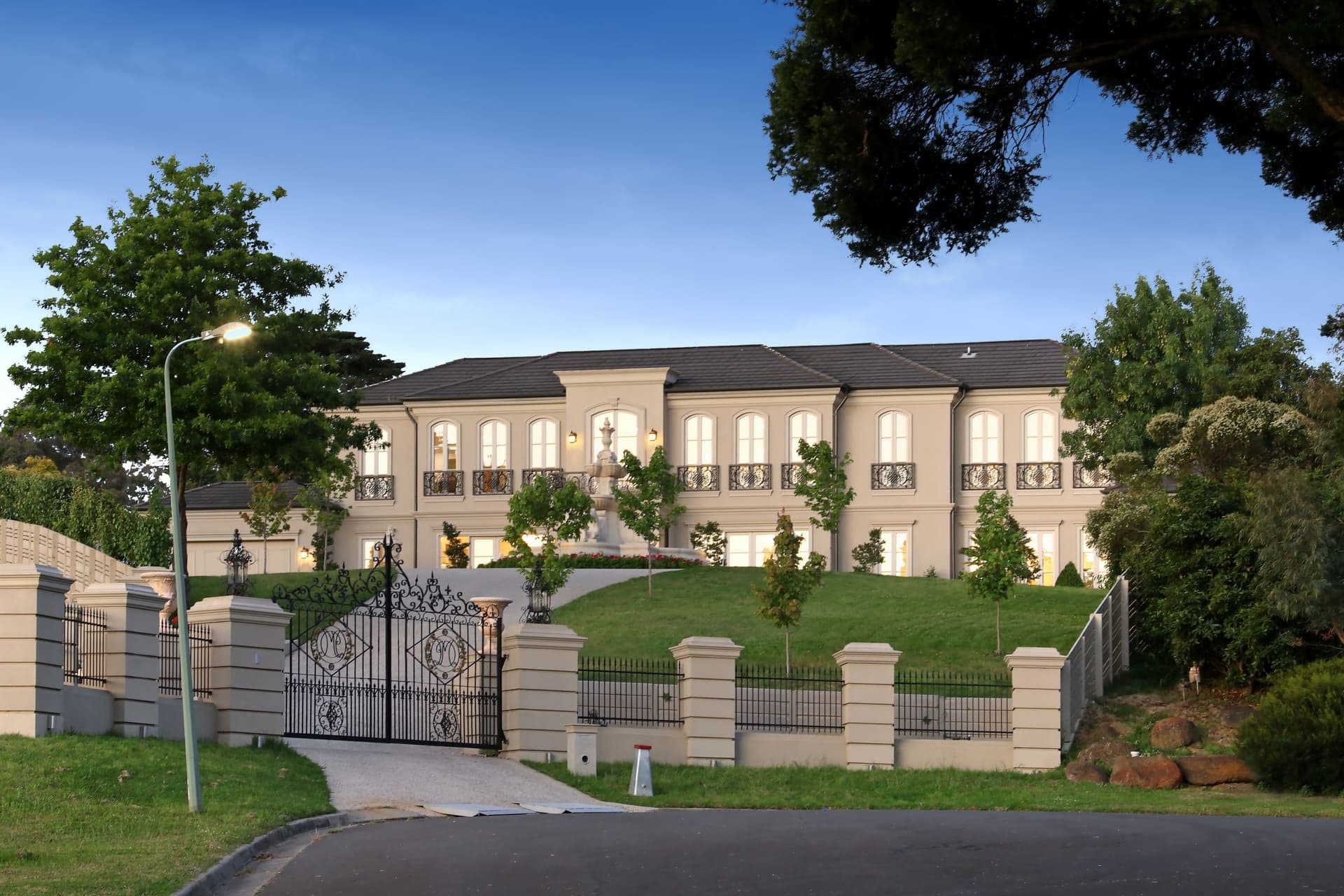 A gated prestige residence in Melbourne's east at dusk